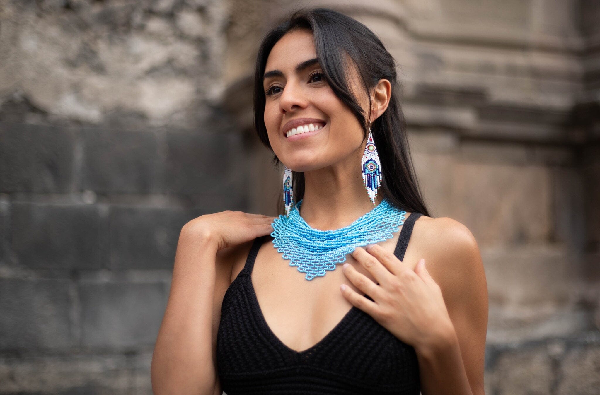 woman wearing azore blue beaded scarf choker necklace native american jewelry and blue hamsa beaded earrings
