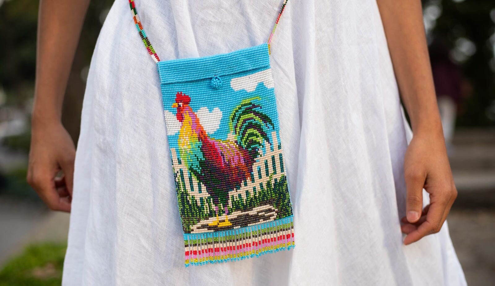 woman wearing burrito gallo rooster beaded purse shoulder bag Blue, White, Red, Yellow, Green, Pink fringe