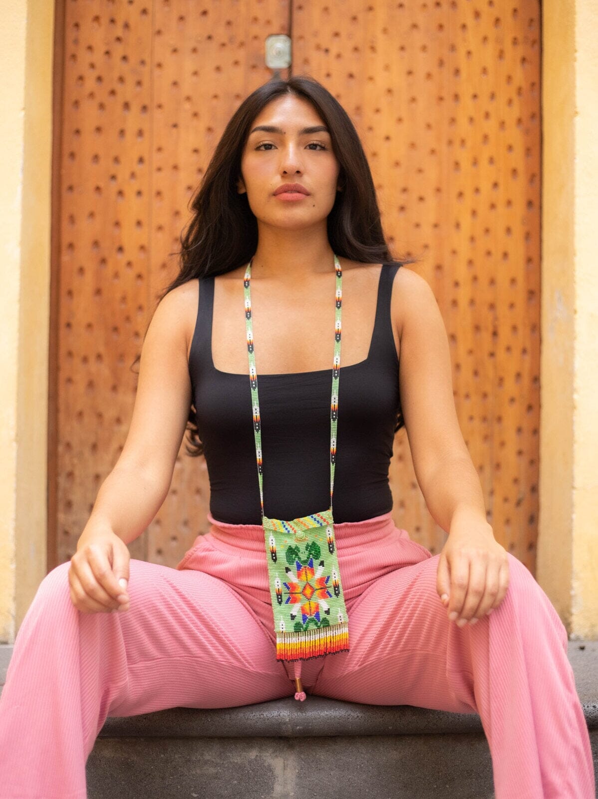 woman wearing coyote green orange red yellow white blue beaded purse bag satchel fringe native american jewelry