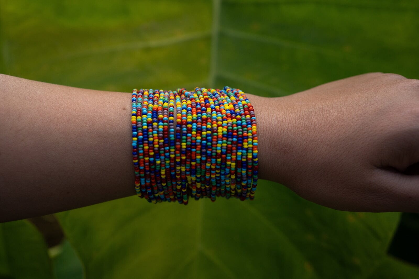 Handmade Fiesta Fusion rainbow beaded bracelet cuff with multi-strand design, showcasing native American jewelry by Mother Sierra.