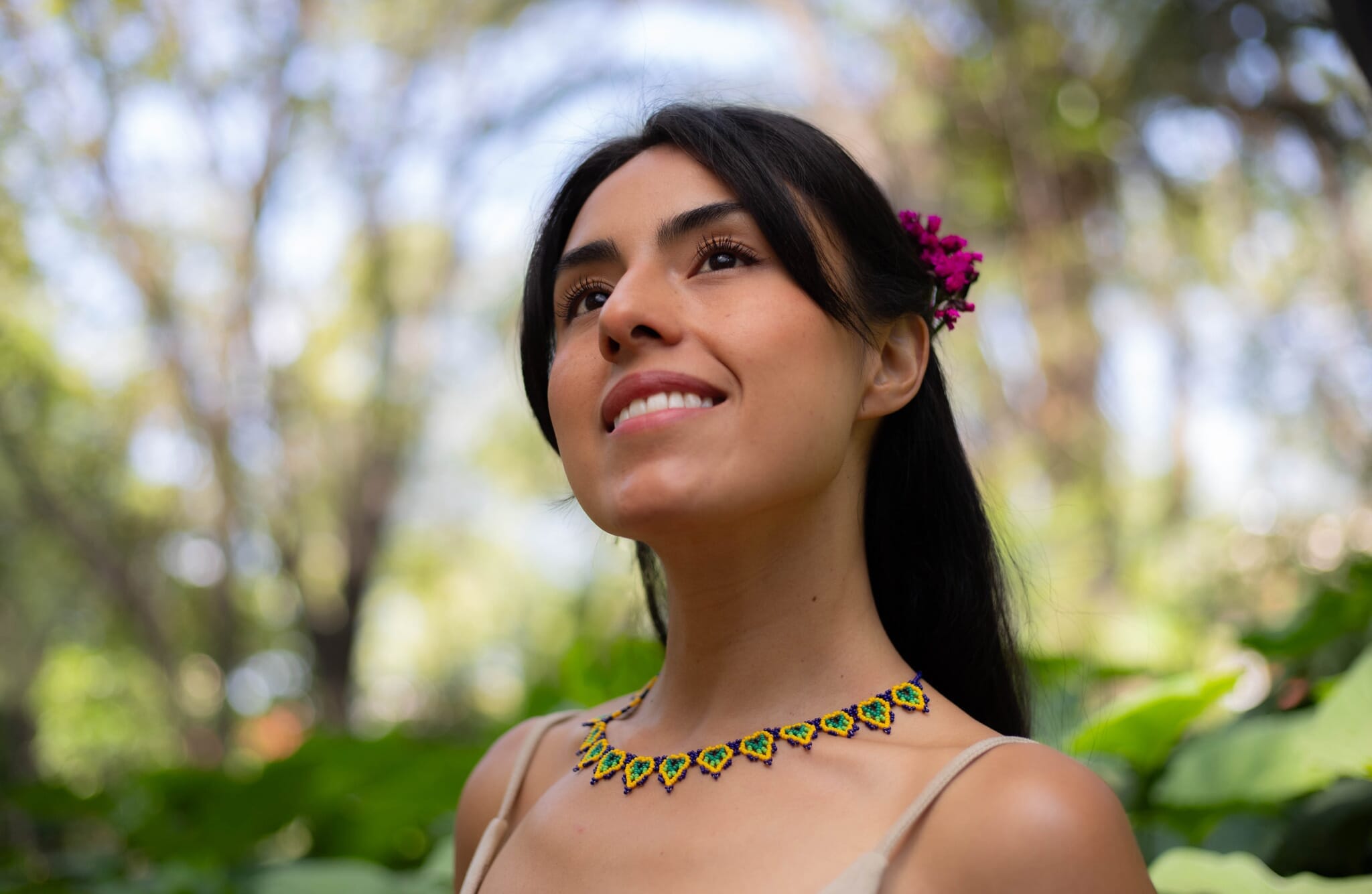 woman wearing gooseberries blue green yellow beaded necklace native american jewelry