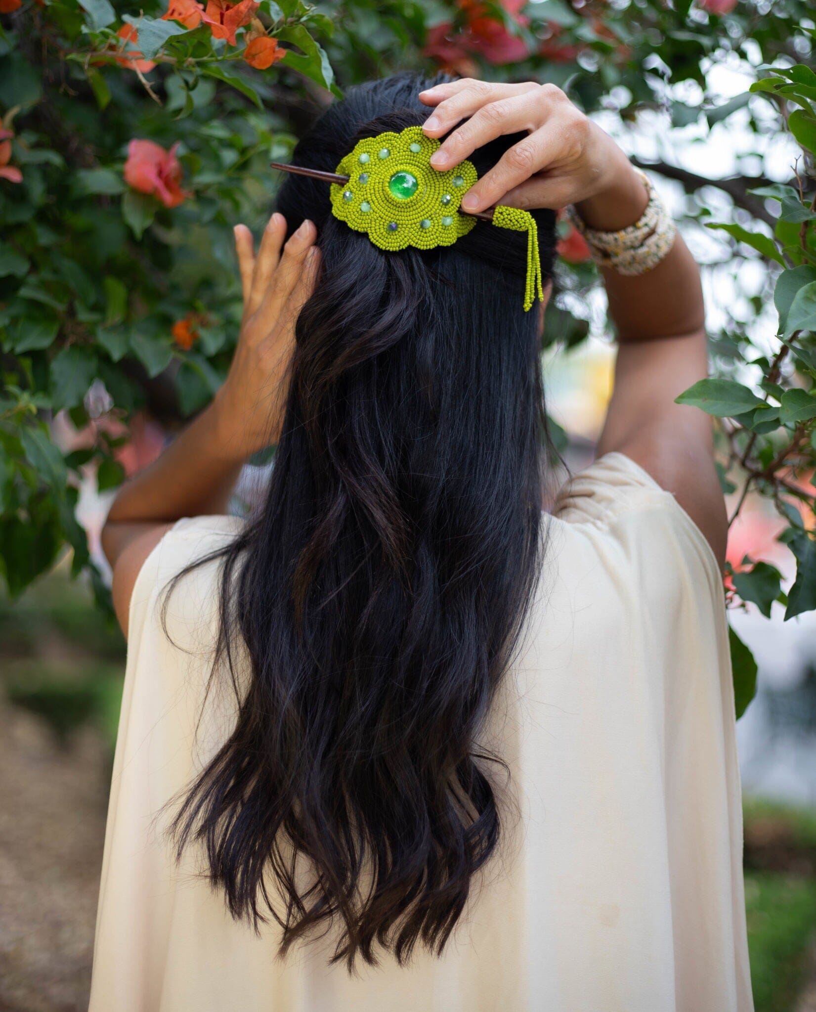 woman wearing key lime green beaded hair barrette and pin statement piece native american jewelry