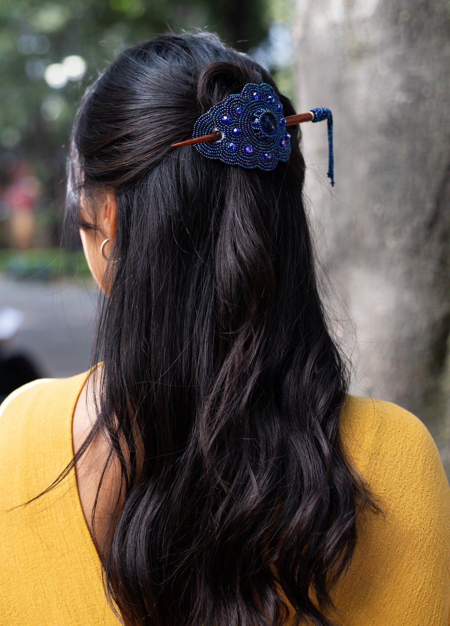 woman wearing midnight steel blue beaded hair barrette and pin statement piece native american jewelry
