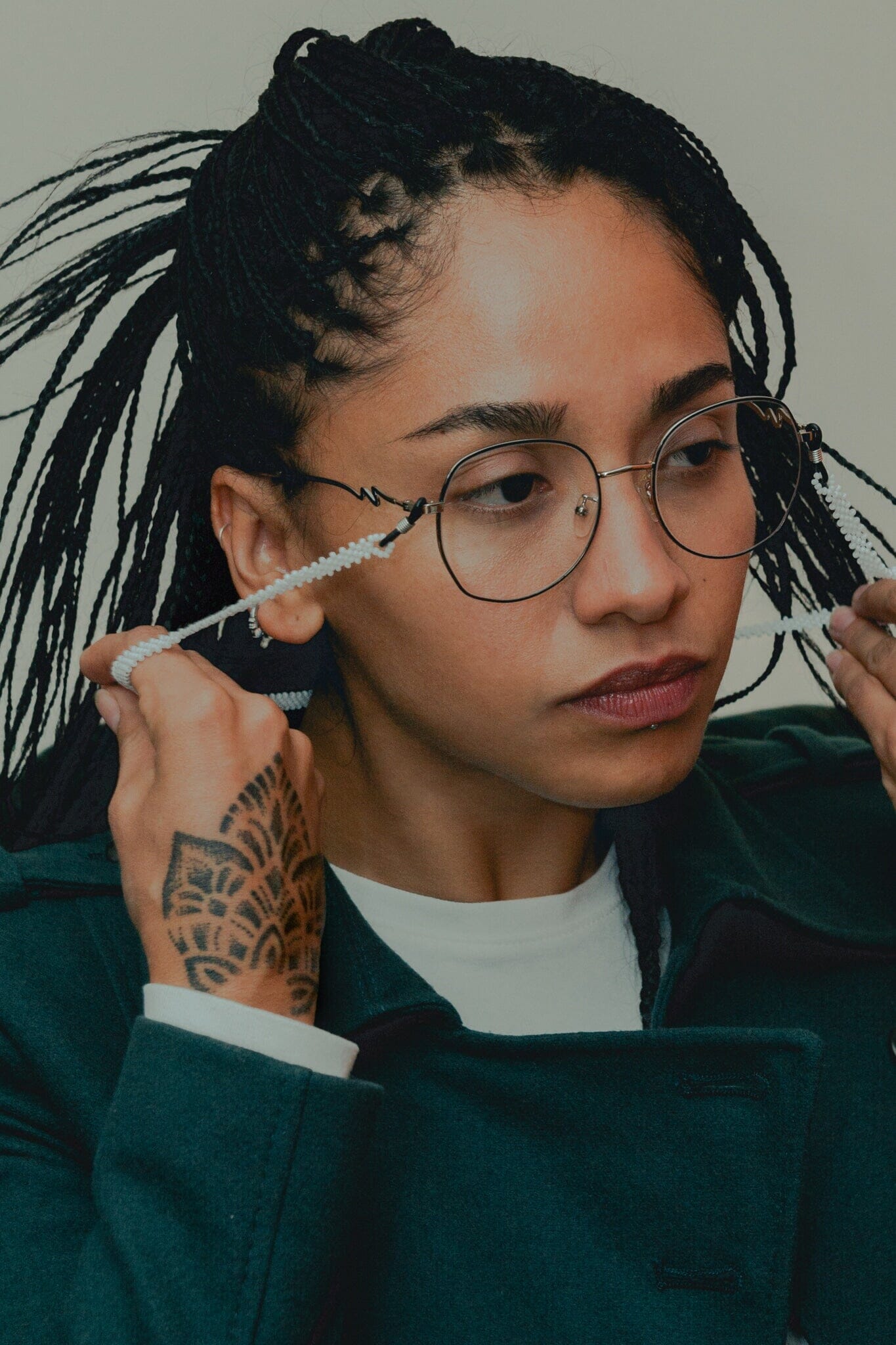 woman wearing pearly whites white beaded glasses chain jewelry