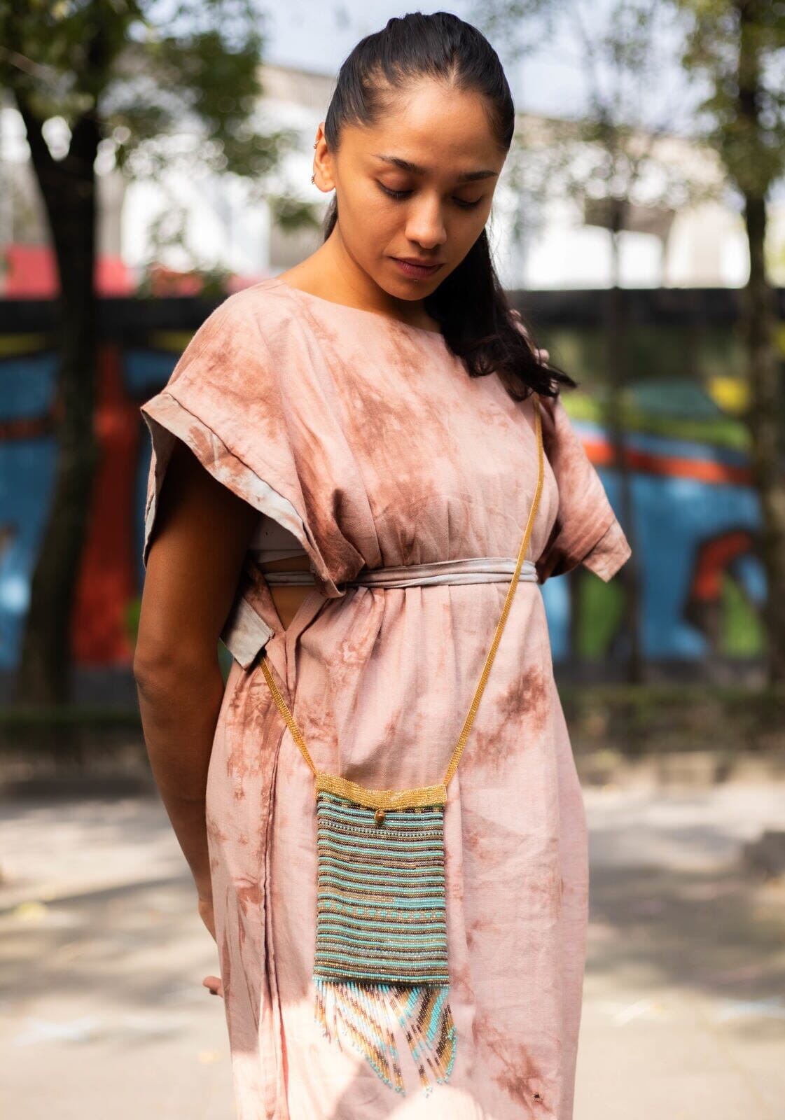 woman wearing persian gold turquoise beaded purse satchel bag fringe native american jewelry