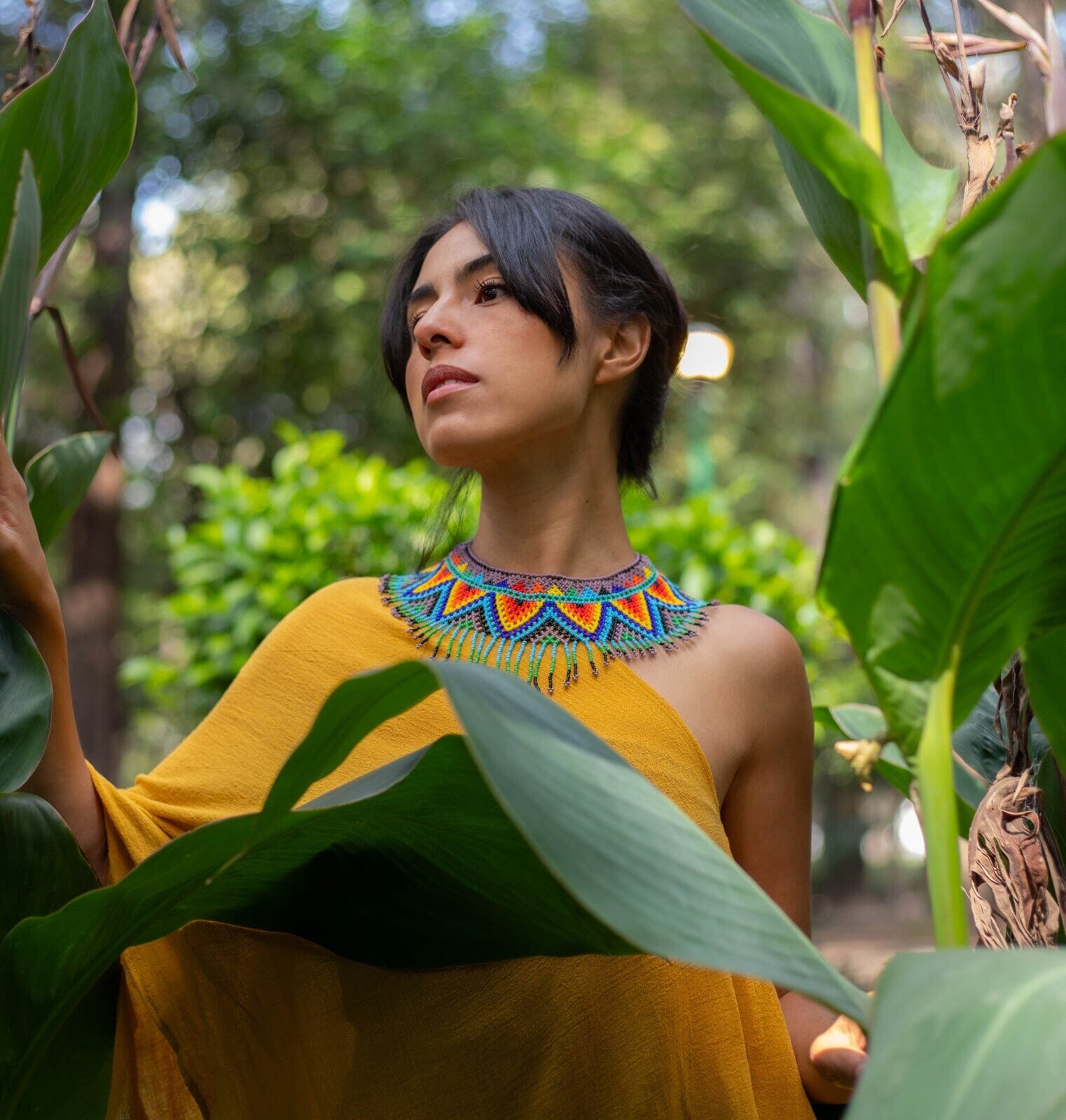 woman wearing beaded tribal choker necklace native american jewelry red orange yellow blue
