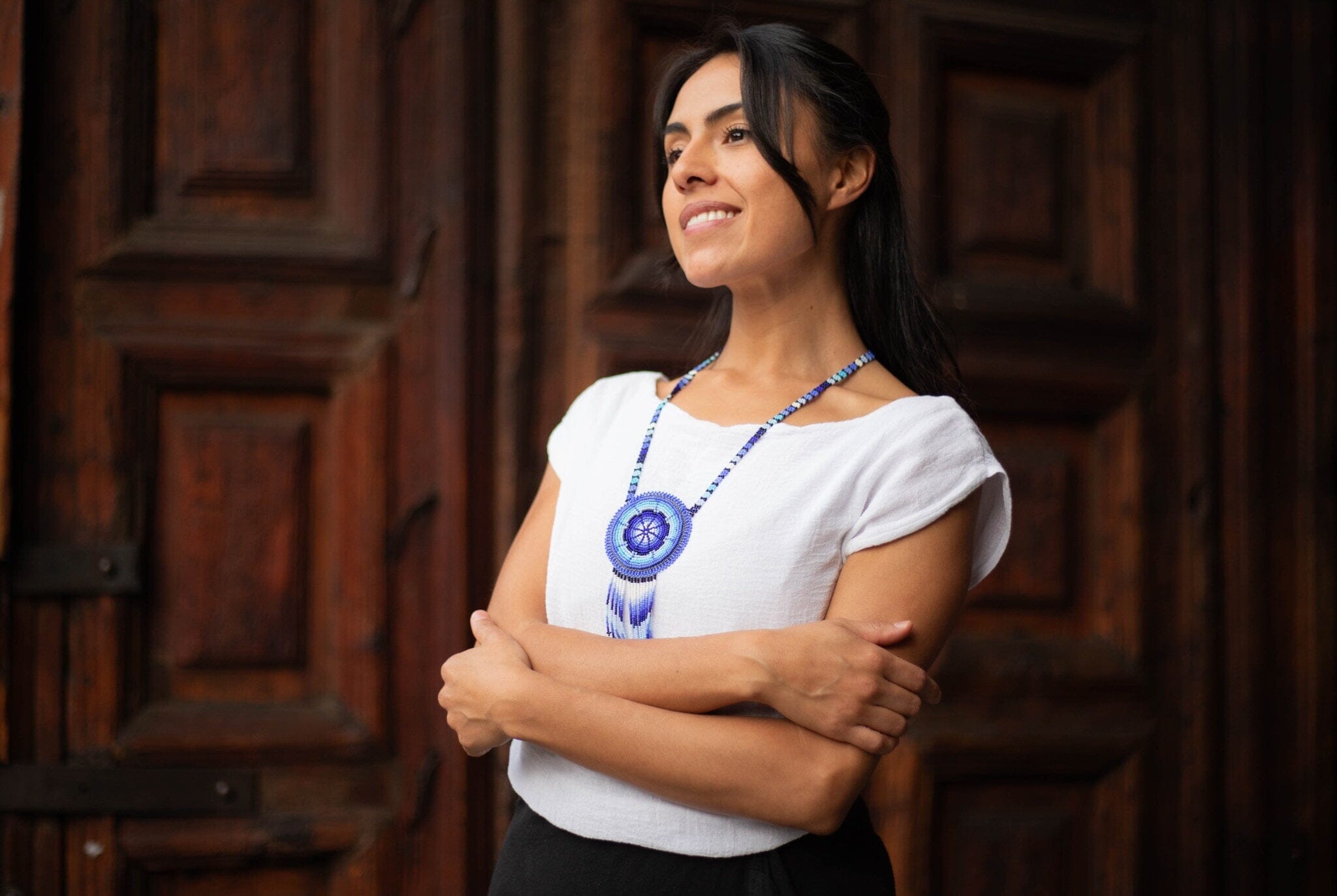 Woman Wearing a Beautiful Blue White Water Handmade Beaded Necklace Medicine Bag