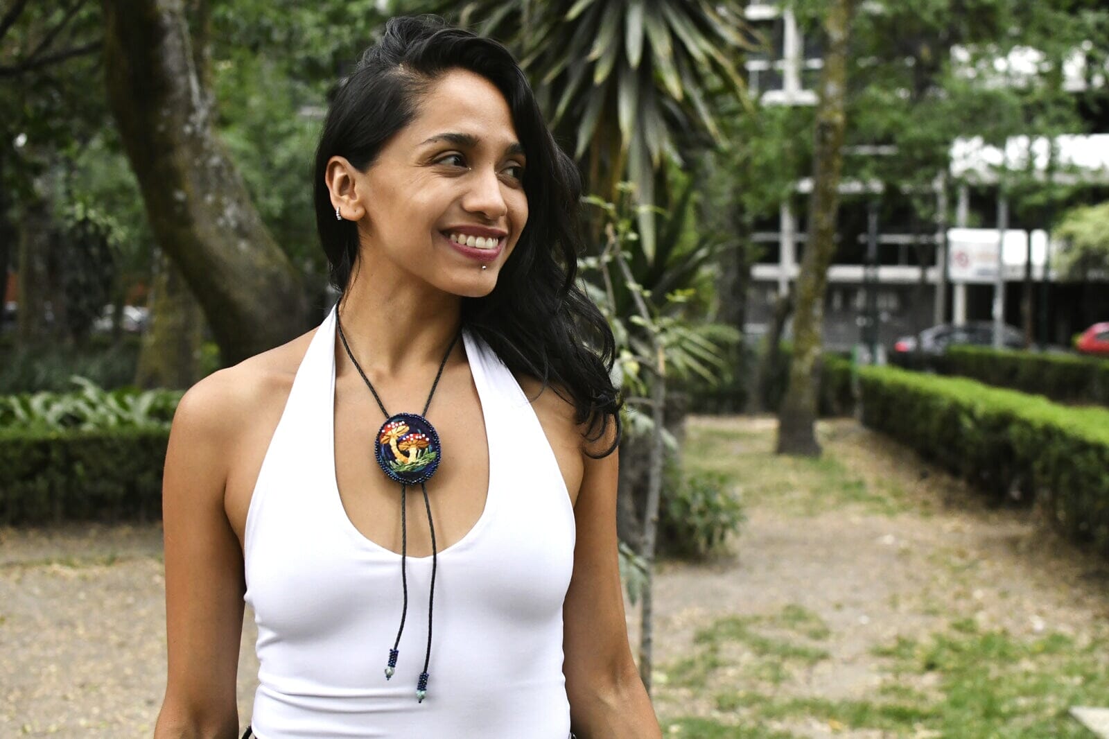 Woman Wearing Briar Patch Embroidered Mushroom Beaded Bolo Tie Necklace Necktie