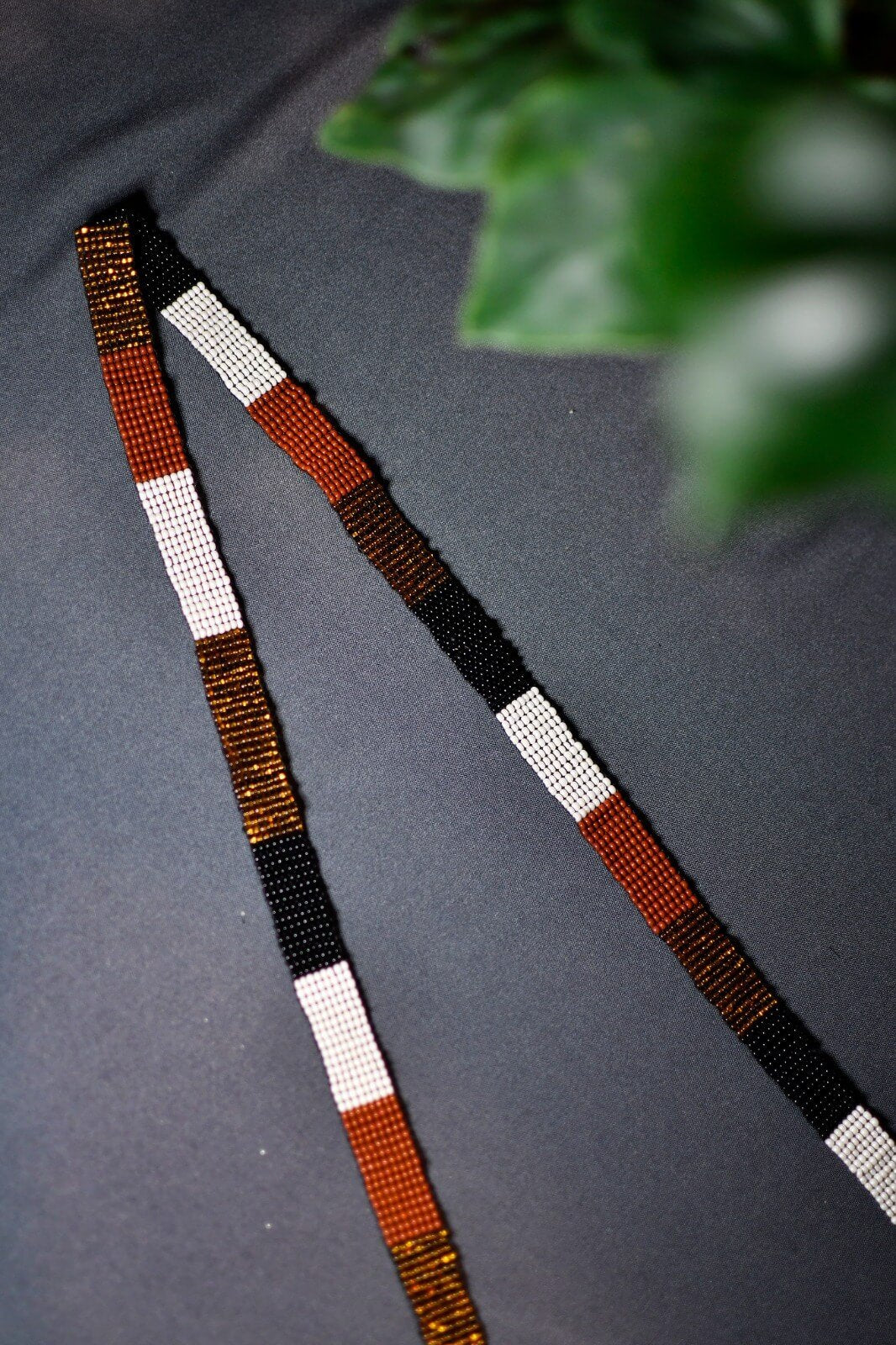 strap close up brown gold black white bronze diamond beaded purse bag fringe