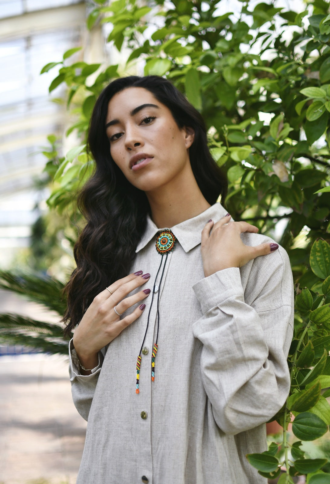 Exquisite beaded neck adornments - Woman Wearing Cattle Kai Beaded Bolo Tie