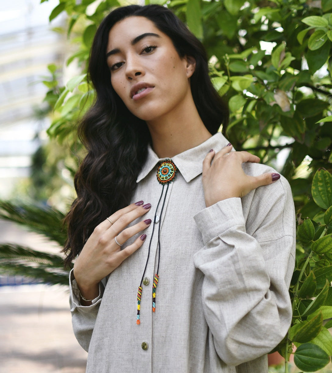 Exquisite beaded neck adornments - Woman Wearing Cattle Kai Beaded Bolo Tie