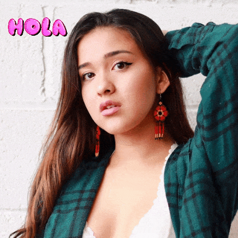 woman wearing read dahlia beaded earrings hola gif