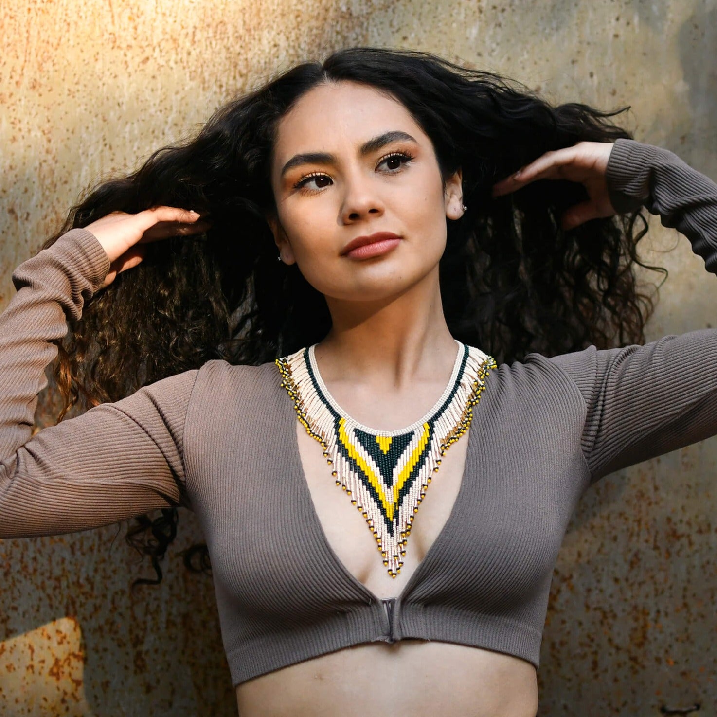 woman wearing desert sunrise yellow gold beaded necklace choker fleko native american jewelry