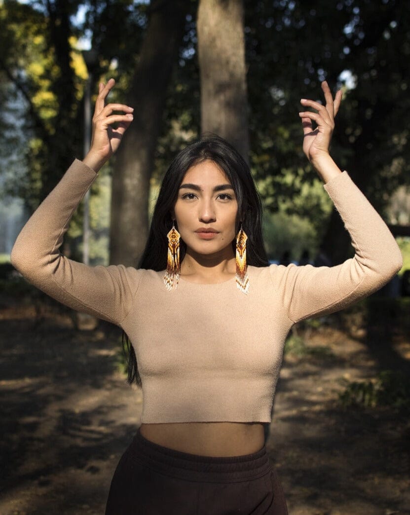 woman wearing sandy white brown yellow fringe beaded earrings