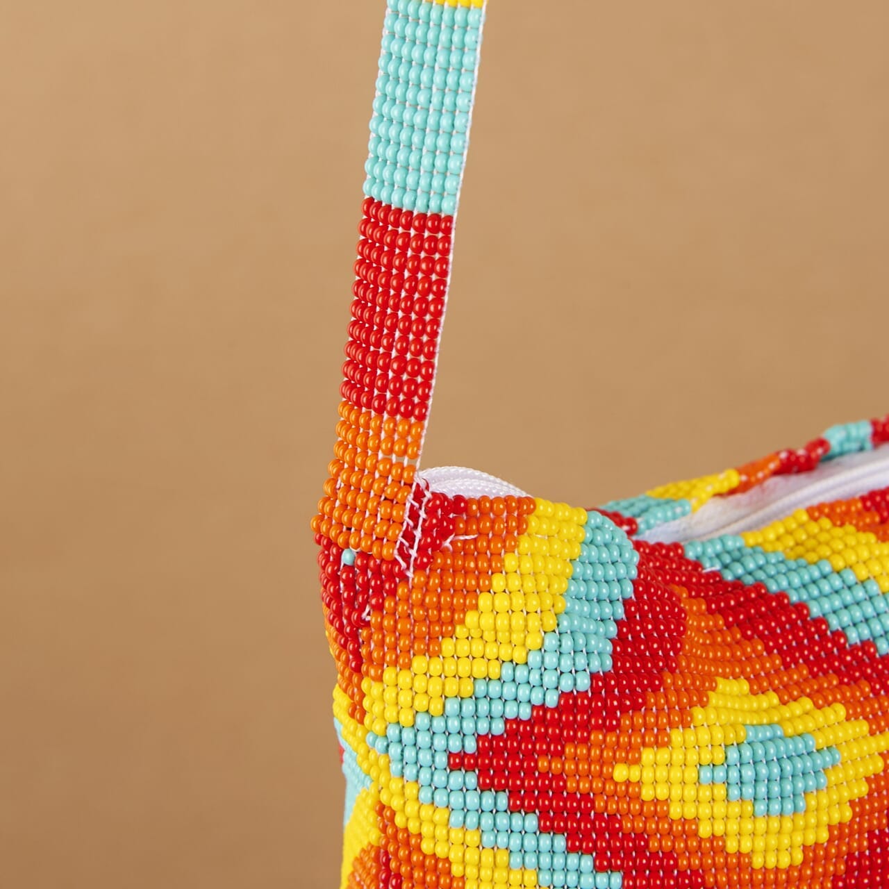 close up yellow orange red teal mania beaded purse bag fringe