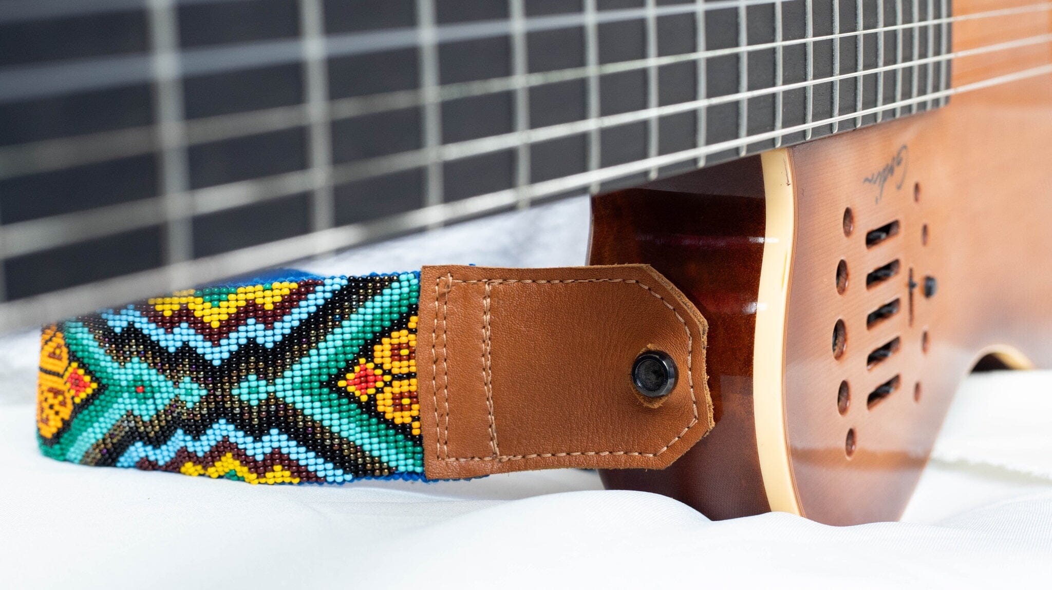 close up Marietta beaded Guitar Strap yellow orange green blue black adjustable leather