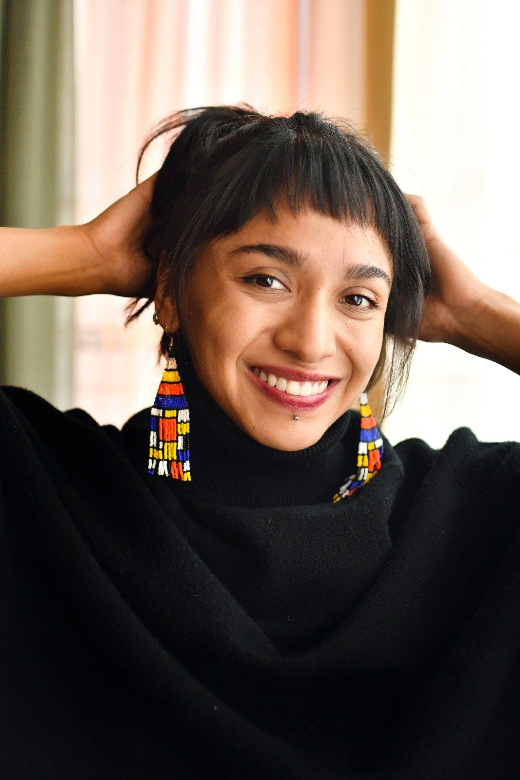 woman wearing Piet mondrain Blocks colorful fringe beaded earrings