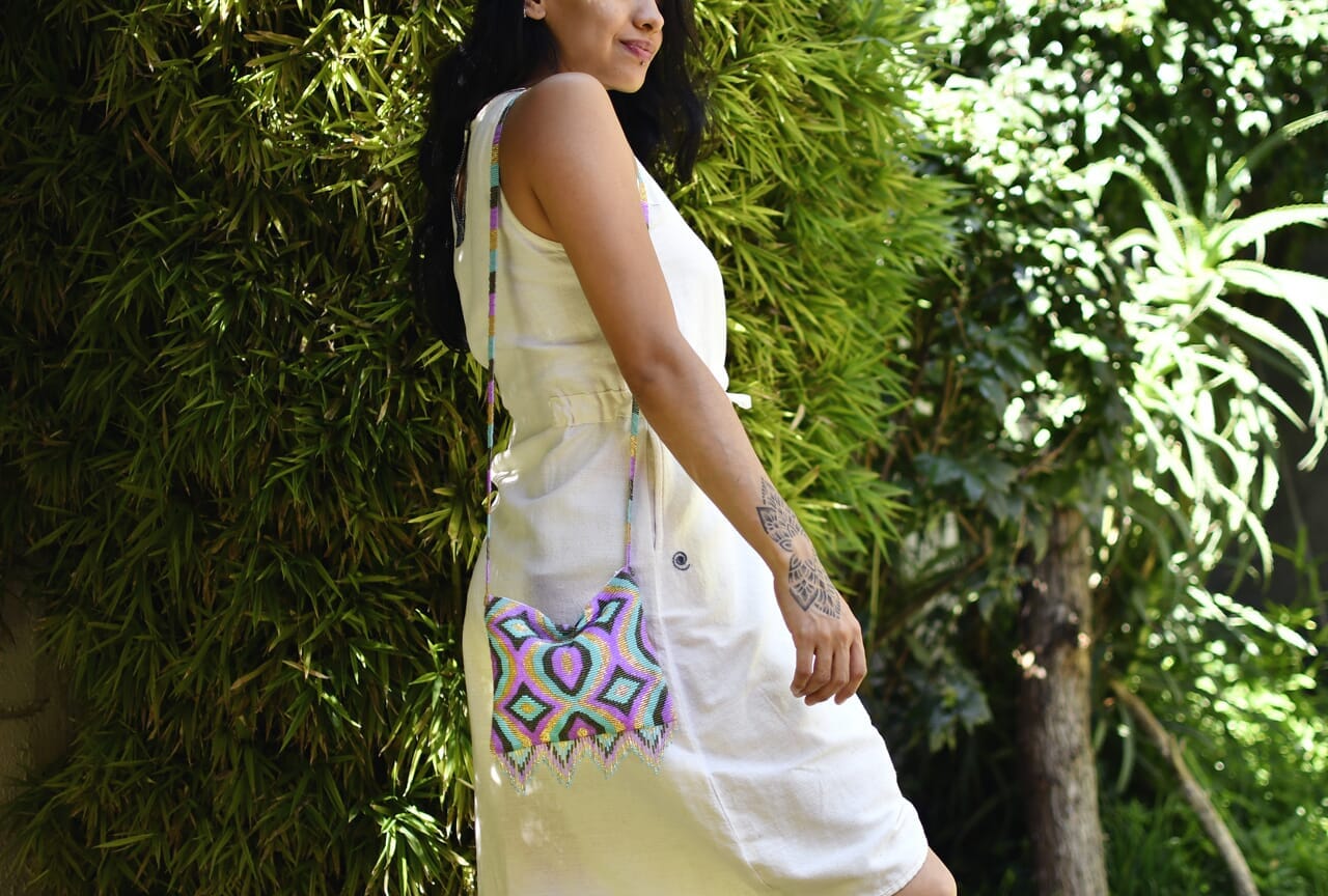 woman wearing teal gold pink lemonade beaded purse bag fringe