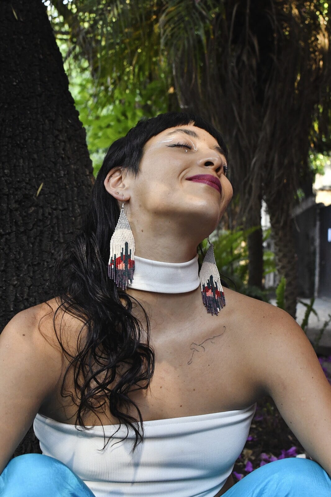 woman wearing Rio Vista gray teal cactus fringe beaded earrings