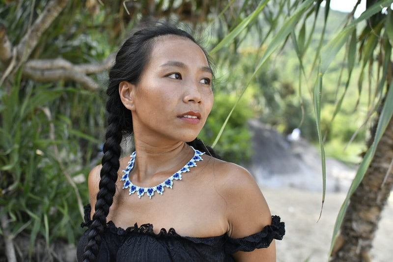 woman wearing blueberries blue white beaded necklace native american jewelry