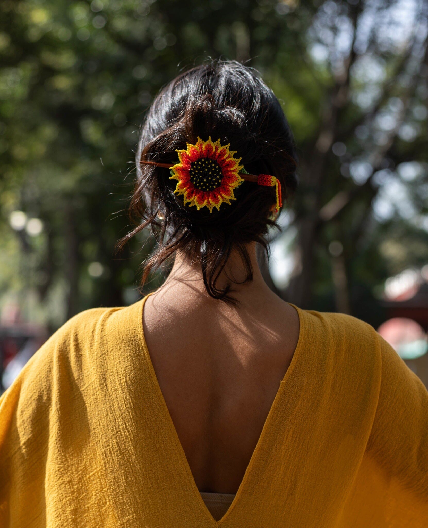 A bright sunflower petal yellow, red, green beaded hair barrette, a hairpiece of Native American jewelry for dark hair.