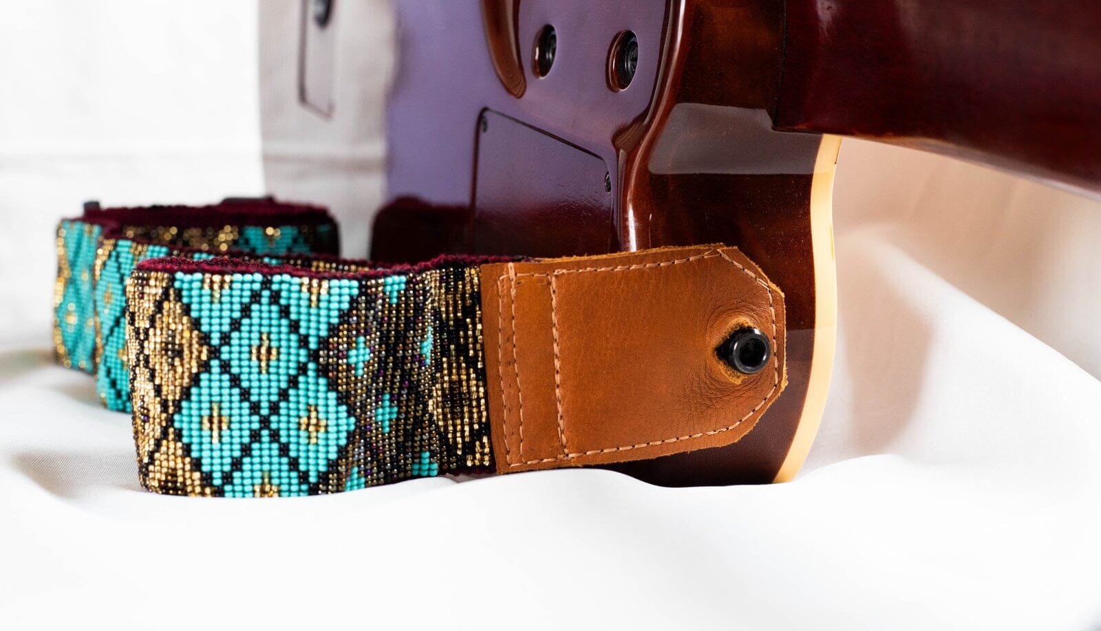 close up Rolling Rock Guitar Strap beaded Guitar Strap leather teal black gold native american jewelry Mother Sierra 