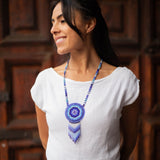 woman wearing blue white water beaded necklace medicine bag native american jewelry
