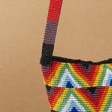 close up balderdash Rainbow Red, Orange, Yellow, Green, Blue, White beaded purse bag fringe