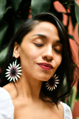 woman wearing white dark brown blanca gradient flower blossom circular beaded earrings