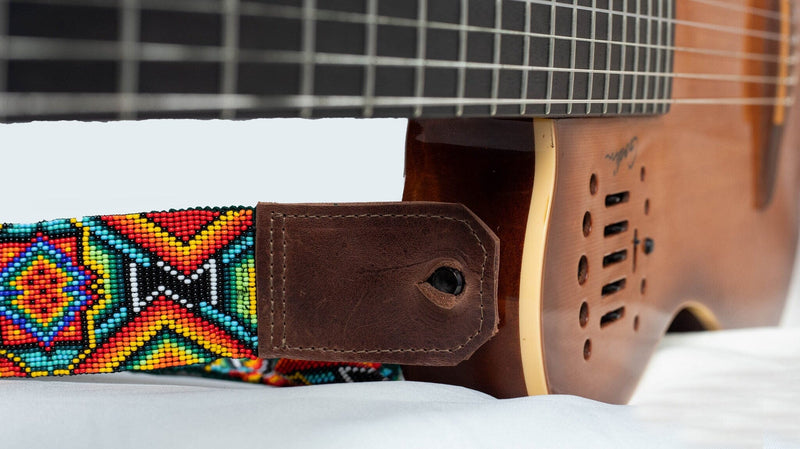 close up Broken Arrow beaded Guitar Strap rainbow red blue green yellow white black adjustable leather on guitar