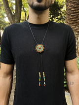 man wearing cattle kai beaded bolo tie orange teal yellow teal necktie necklace native american jewelry