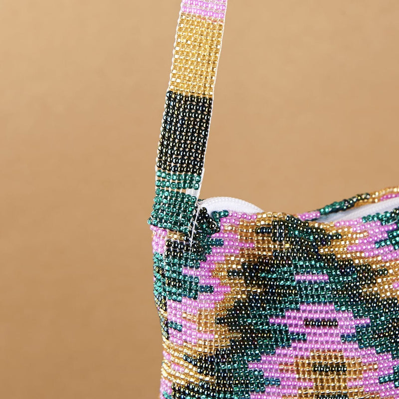 close up gold pink teal green beaded purse bag fringe