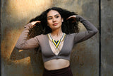 woman wearing desert sunrise yellow gold beaded necklace choker fleko native american jewelry