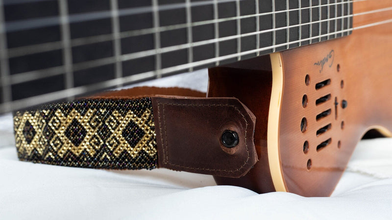 close up Grecian Gold beaded Guitar Strap black gold mosaic adjustable leather on guitar