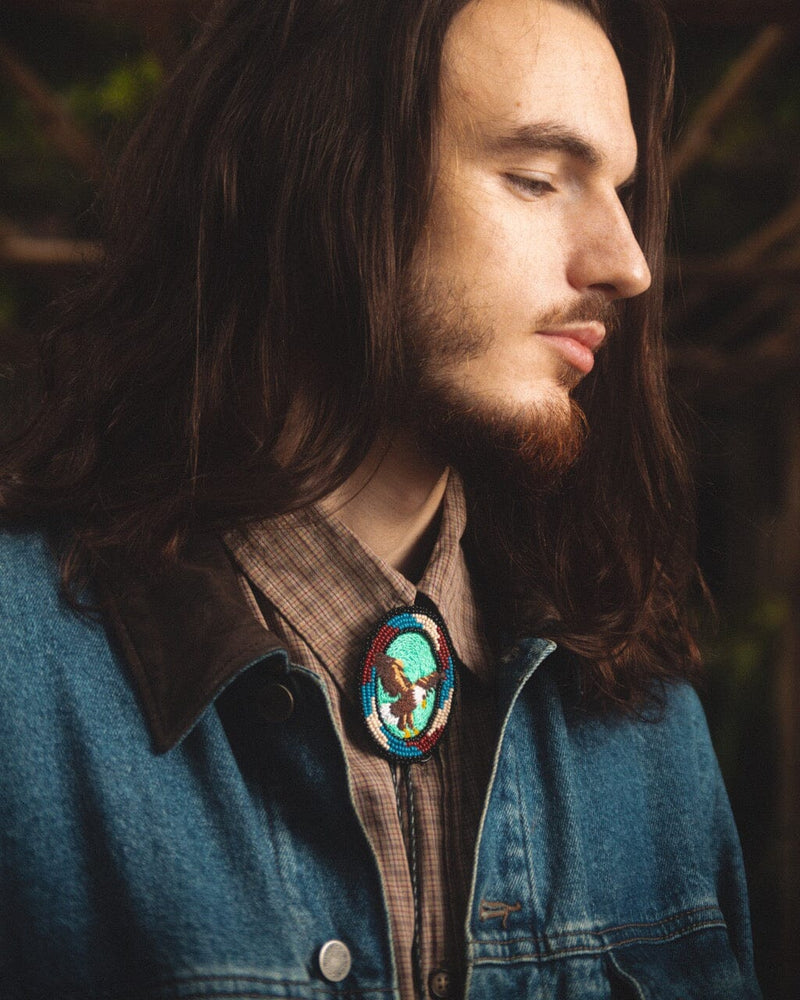 man wearing hunter eagle brown aventurine teal white blue beaded Bolo Tie necklace necktie embroidered native american jewelry