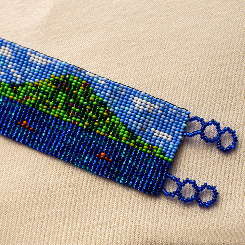 close up Lago de Atitlán blue sky green mountain lake beaded bracelet cuff