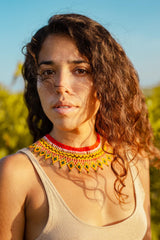 woman wearing red yellow white black green makeda queen of sheba choker beaded necklace tribal native american jewelry