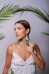 woman wearing palm tree paradise fringe beaded earrings