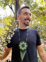 man wearing peyote green black beaded necklace bag fringe native american jewelry