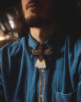 man wearing phoenix brown aventurine black white beaded Bolo Tie necklace necktie embroidered native american jewelry