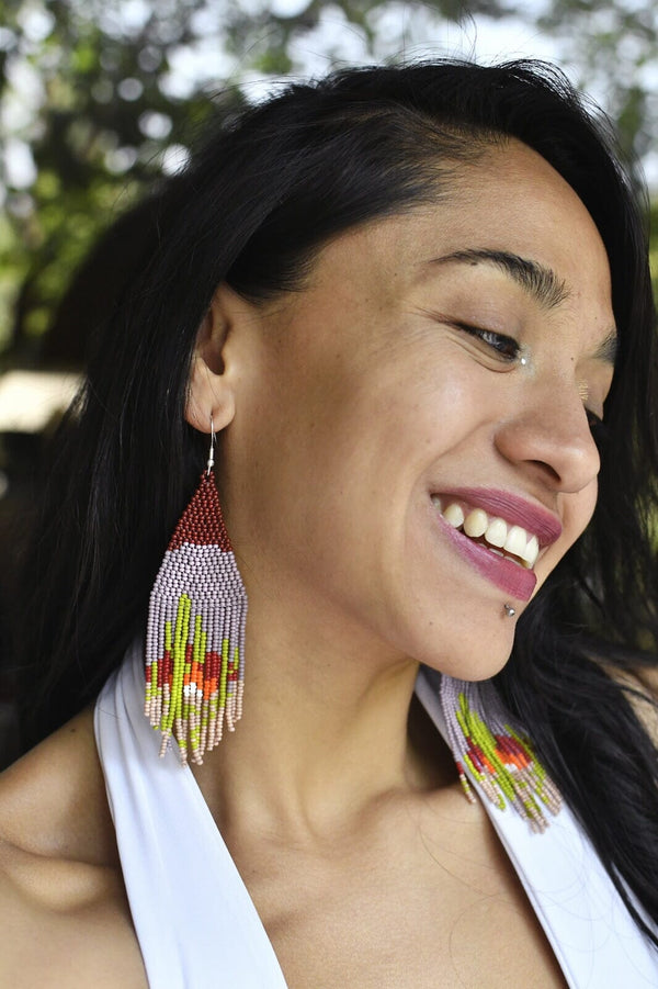 woman wearing Sandstone cactus gray fringe beaded earrings smiling
