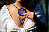 woman wearing wind blue yellow white gray black beaded necklace medicine bag fringe native american jewelry